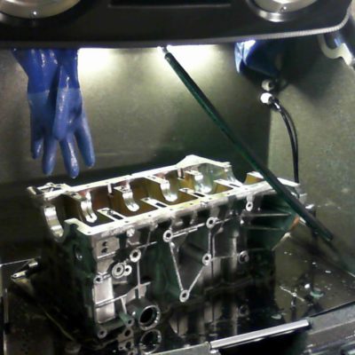 Cleaning BMW header in Torrent 500 parts cleaning machine